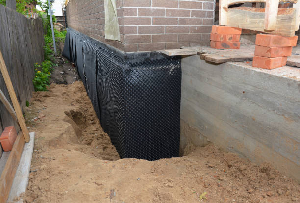 SJ Waterproofing Pros technician performing targeted Vapor Barrier Installation assessment in Independence, KS